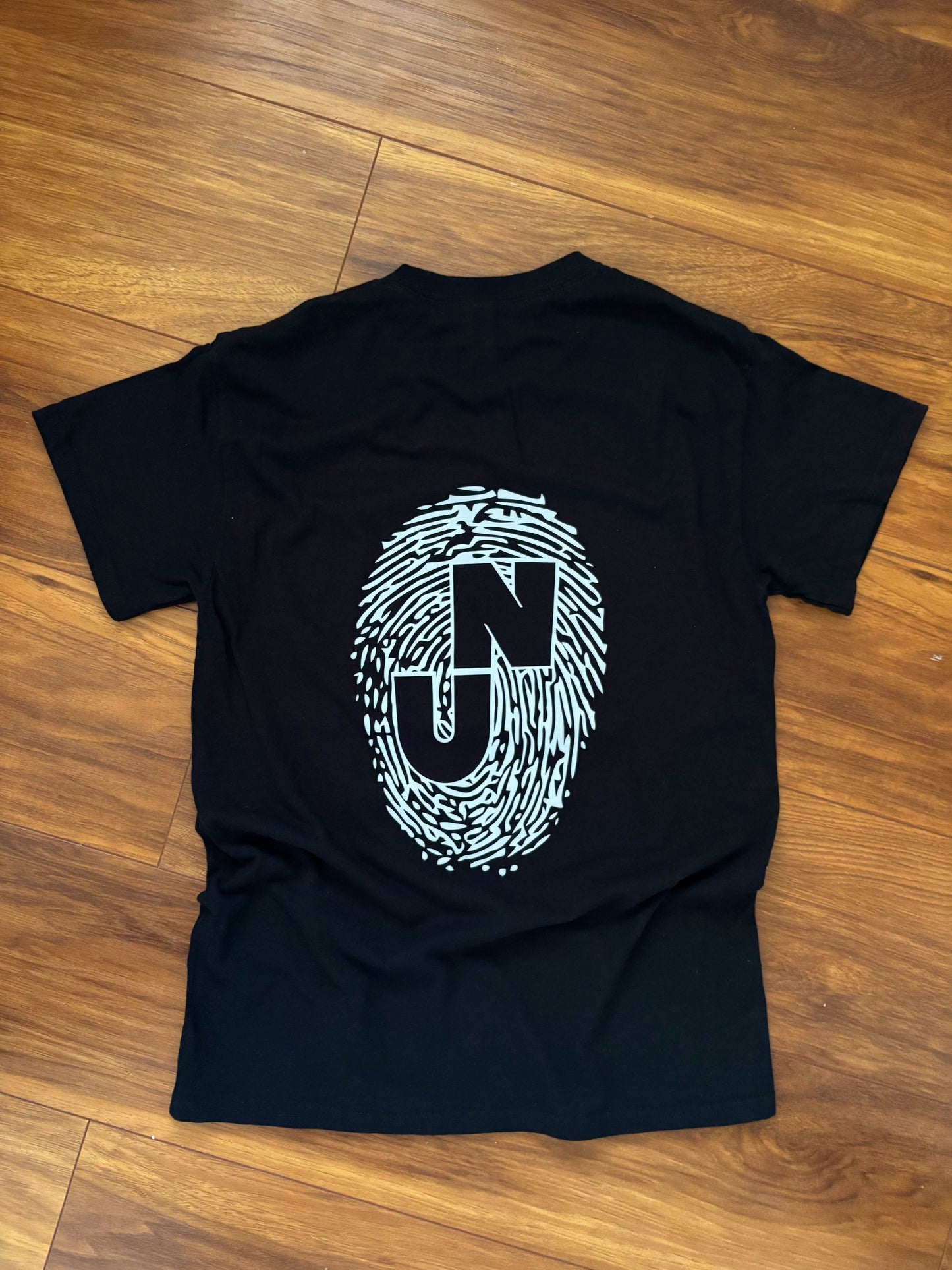 “The First Mark” black tee